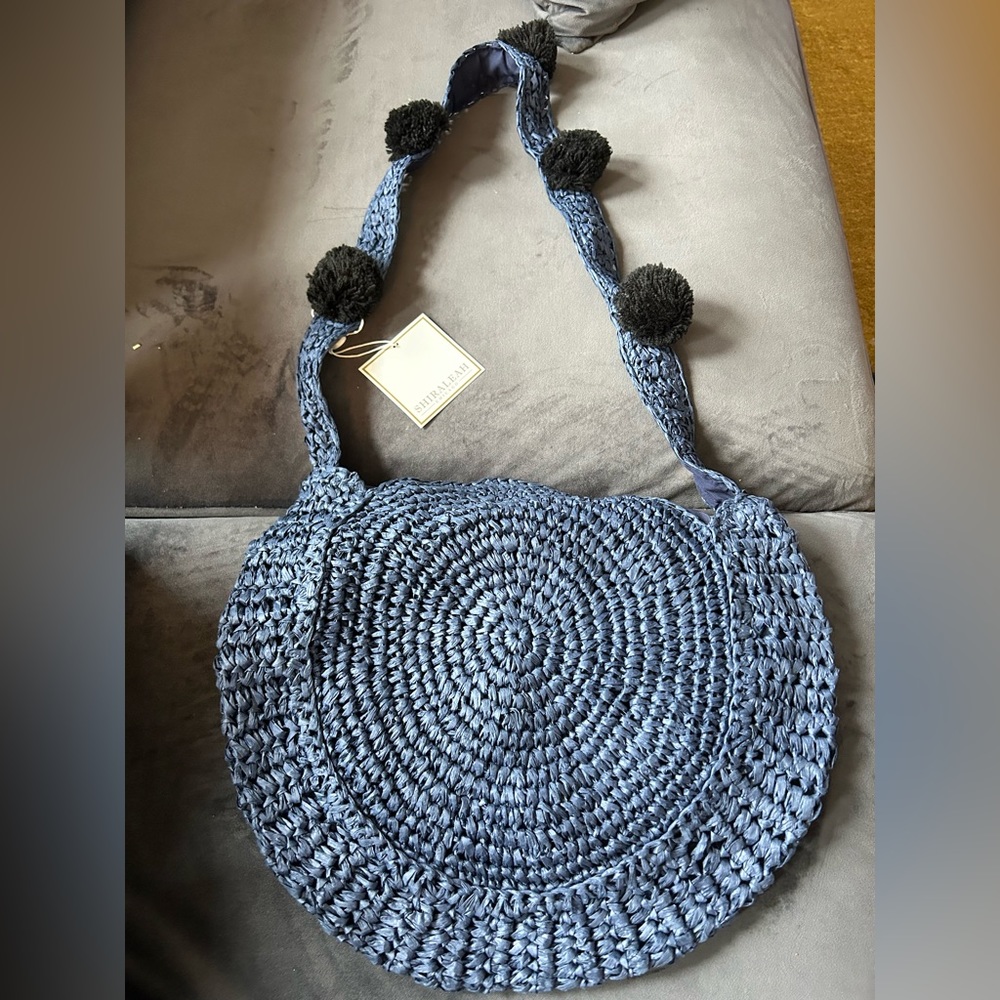 Shiraleah Chicago round straw bag with pompoms